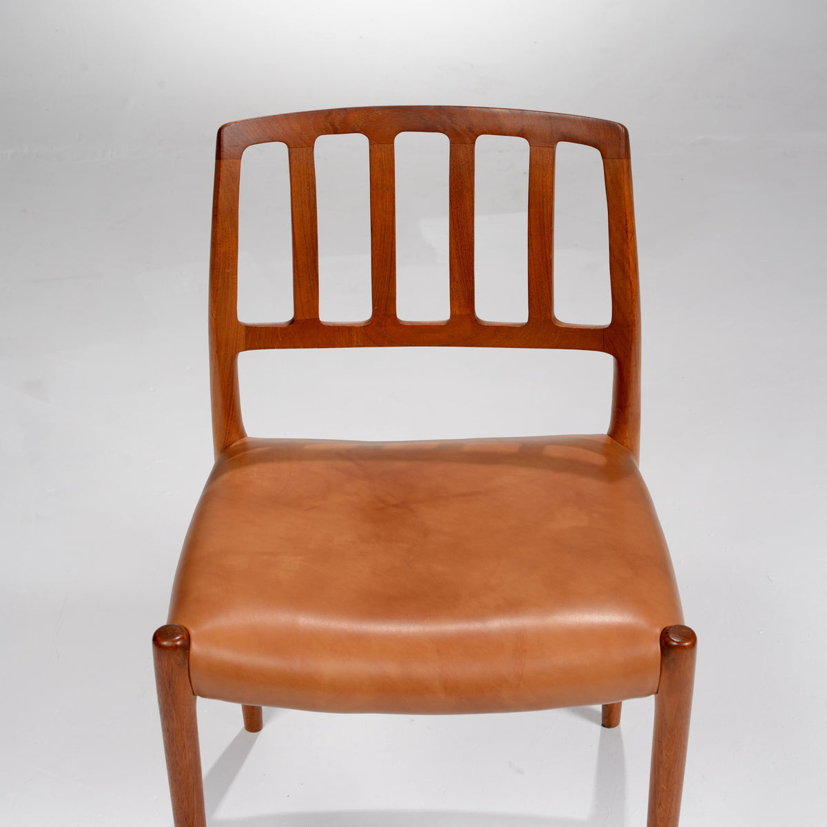 Niels Otto Møller Model 83 teak and leather dining chair detail 4