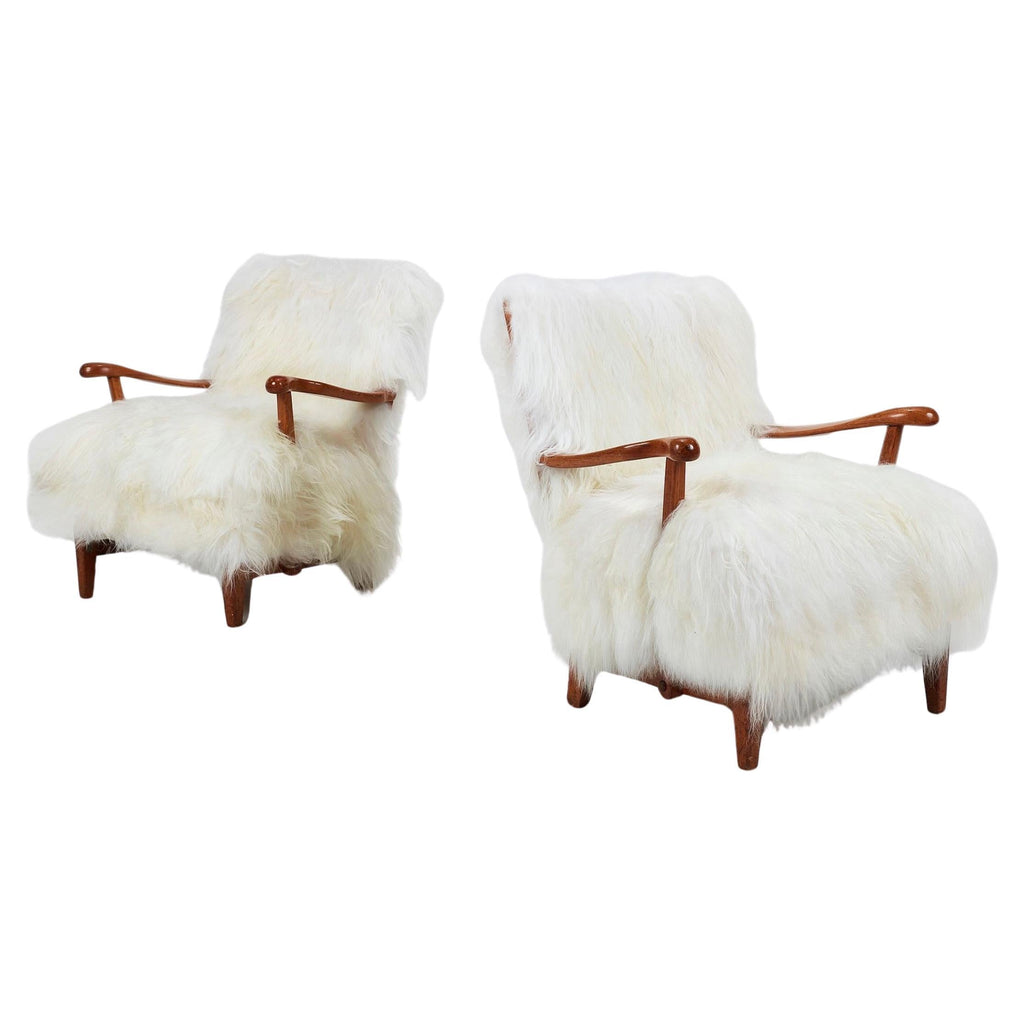Pair of Elias Svedberg 1939 lounge chairs with wood frames and long-pile white wool upholstery