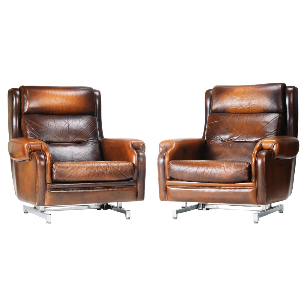 French leather and chrome reclining lounge chairs, two available