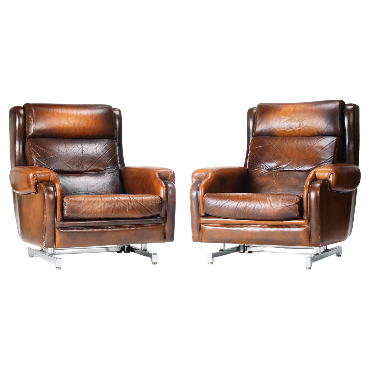 French leather and chrome reclining lounge chairs, two available