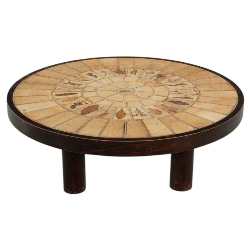 Stamped Roger Capron Garrigue round coffee table with radial botanical tile composition, circa 1960 - view 1